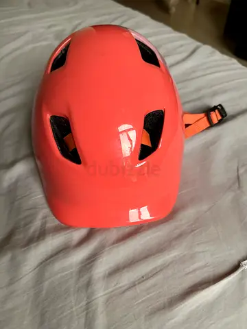 Kids coral bike helmet with adjustable strap — excellent condition