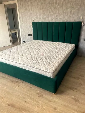 Green upholstered bed frame with mattress (used, good condition)