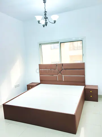 My brown upholstered double bed with headboard and 2 bedside tables