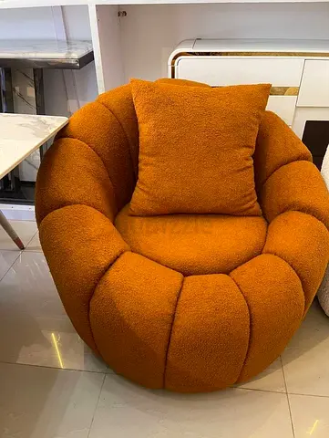 Orange bouclé round lounge chair - comfortable armchair