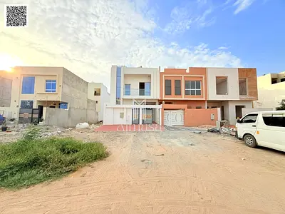 Villa at an attractive price, European design, on a main street, large exterior setback, super deluxe finishing, prime location opposite Al Safir Mall