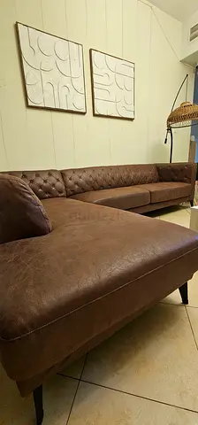 Brown tufted L-shaped faux leather sectional sofa