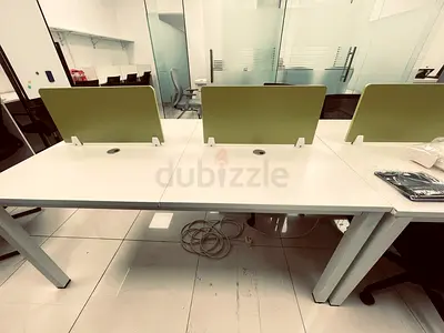 3-person white benching workstation with green privacy screens