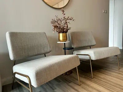 West Elm - upholstered chair with brass frame - gently used