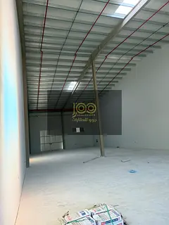 Warehouse available for rent in Umm Al Thuoob Industrial Area with 70 kW electricity.