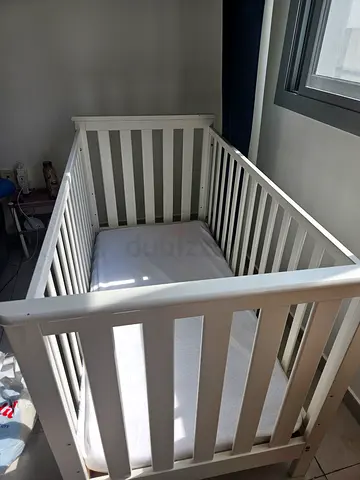 My white wooden baby crib - good condition