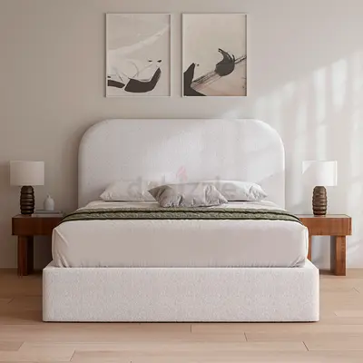 My upholstered bed with rounded headboard — neutral cream fabric