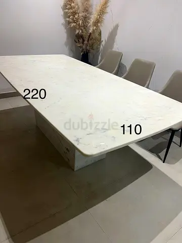 Selling my white marble dining table — 220 x 110 cm, seats 8 (AED 300)