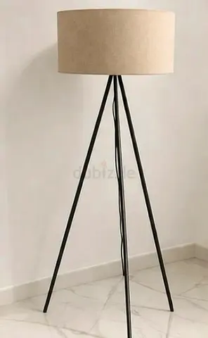 Tripod floor lamp with beige drum shade