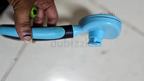 Lightly used pet grooming brush — ergonomic pin brush