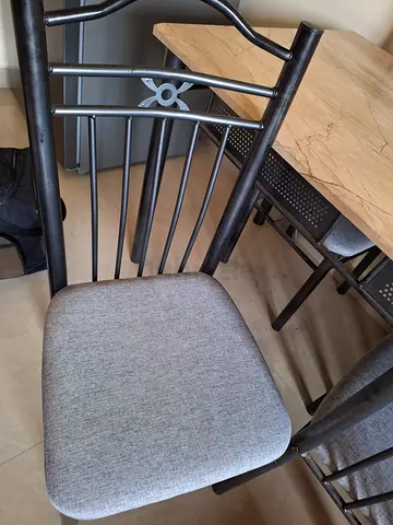 Metal dining chair with grey upholstered seat — good condition