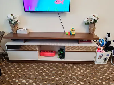 My modern TV entertainment unit — wooden top with white drawers