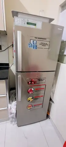 Silver double-door refrigerator —good working condition