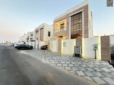 Villa for sale in Ajman, Al Yasmin area. Two floors and a roof terrace. 7 master bedrooms. Price includes air conditioning, electricity, and water. Fr