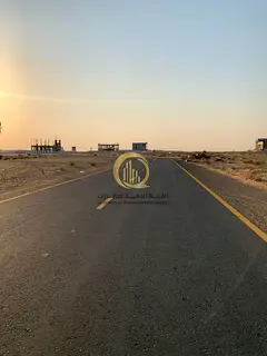For sale: residential and commercial land in Rawdat Al-Qurt, Al-Ruwaidat suburb, in a lively locatio