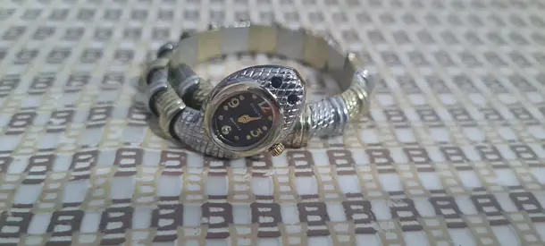 My silver-tone bracelet with small working watch