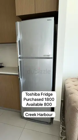 Toshiba 2-door silver fridge (top freezer) — good working condition