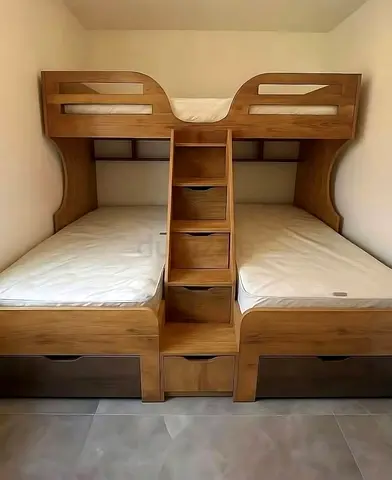 bunk bed with staircase and storage