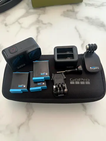 GoPro Hero 9 with 2 additional batteries, hard shell case, dual bay charger, and mounding kit