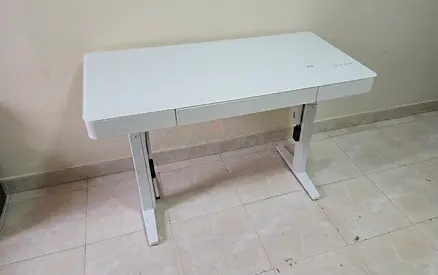 White glass top smart desk with wirless mobile charger and Bluetooth speeker