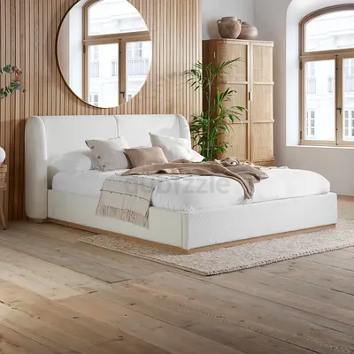 Im selling my white upholstered platform bed with padded headboard — gently used