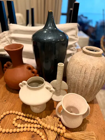 Set of assorted decorative vases and wooden bead garland