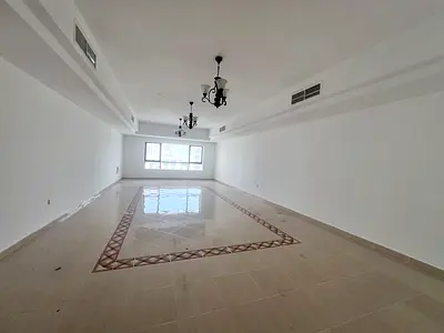 3-bedroom apartment with city view, living room, master bedroom, maid’s room, kitchen, free AC, gym & pool, near Dubai exit.