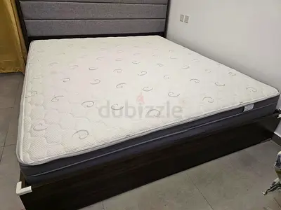 king size bed with a cot(negotiable, its high quality. original price 5k)