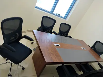 6-seater wooden meeting table with 6 ergonomic mesh chairs