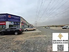 Residential land for sale in Al Yasmeen, Ajman, corner plot on two streets, prime location near the