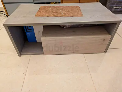 Compact low center table with drawer — light wood