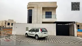 Corner villa for sale in Ajman, Al Zahiyah area. It features 5 master bedrooms, a majlis, a living r
