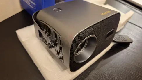 Compact portable projector (works well but with a shading in the center, includes remote)