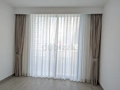 Beige curtain pair with white sheer voile — like new