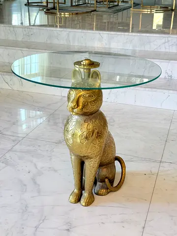 Brass cat accent side table with round glass top