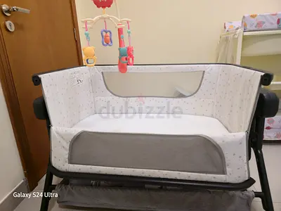 bedside bassinet with swing, music function with remote.