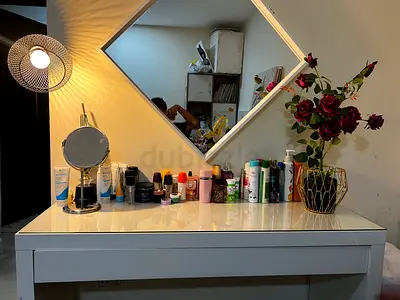 White coloured vanity, with mirror. very elegant and classic.