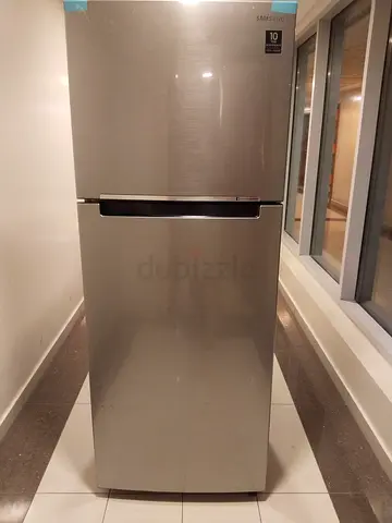 Samsung top-freezer refrigerator (stainless steel) — good working condition