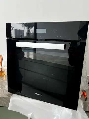 The Miele H6461BP is a 60cm, 76-litre Pyrolytic electric built-in oven , DELIVERY+ WARRANTY