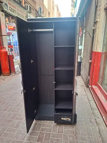 My large black wardrobe/armoire with shelves and drawers