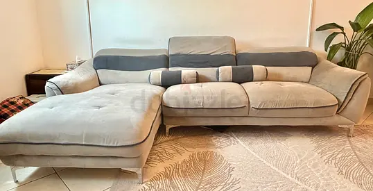 L-shaped homecenter sofa, stylish gery color, 4 seater, 2 cylinder pillows and adjustable head