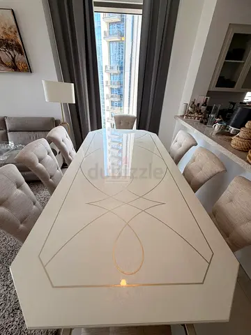 My white gloss dining table with tufted beige chairs - dining set