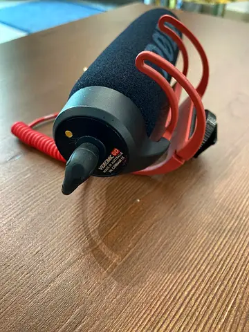 RODE, On-camera shotgun microphone with shock mount and coiled cable — working perfectly