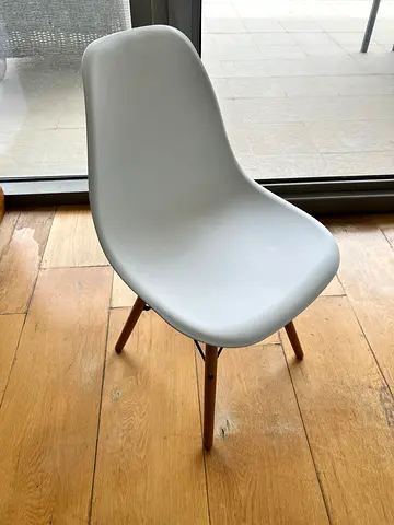 White molded plastic dining chair with wooden legs - good condition