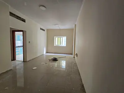 One-bedroom apartment with a spacious living room and balcony, located in Al Qasimia Al Mahatta