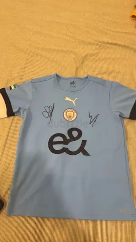 Signed man city shirt by haaland and riyad mahrez