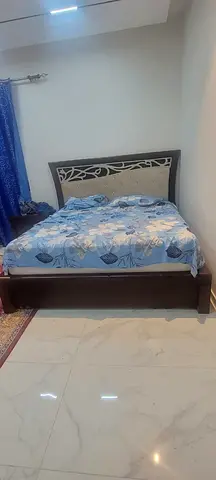 Double wooden bed frame with upholstered headboard and Medicated Mattress used, good condition for s