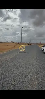 For sale: Residential land in Al-Sahmah, area of 2,497 square feet on an 18-meter street, close to t