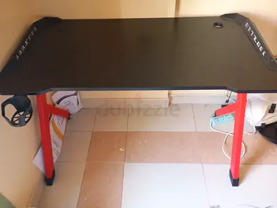 My gaming desk — black top with red legs (lightly used)