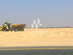 Exclusive Offer in Al Sahmah – Two Adjacent Plots in a Prime Location